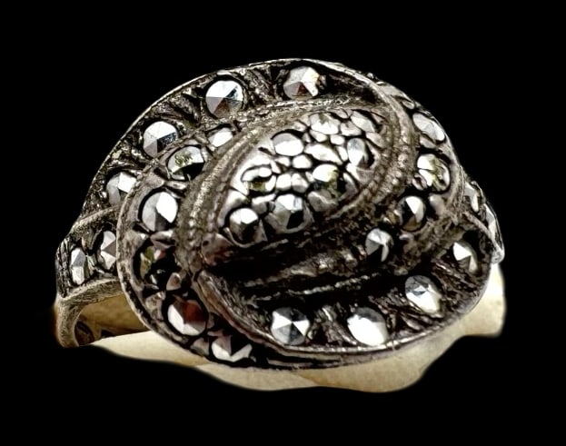Vintage Sterling Silver & Marcasite Designer Ring: Very good vintage condition with minor patina according to age. The The ring is a size 6.25 and weighs ca. 4.1 grams. Marked for Sterling Silver.and carrying an unidentified designer mark in the shape