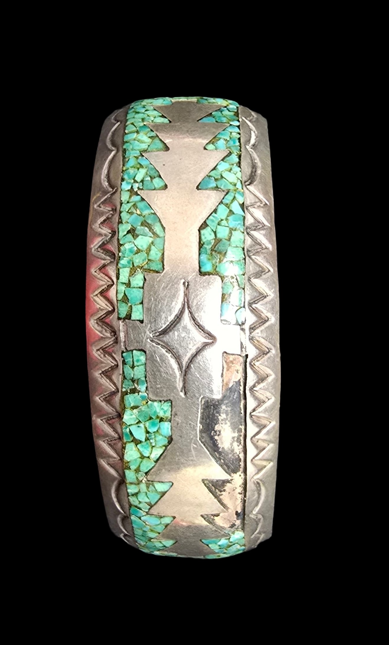 Ornate Vintage Native American Navajo Sterling Silver & Green Turqouise Inlay Bracelet: Very good vintage condition with minor patina according to age; missing some stones. Measures approx. 2 1/2" wide (inside diameter) and weighs ca. 40 grams. Marked for Sterling Silver.