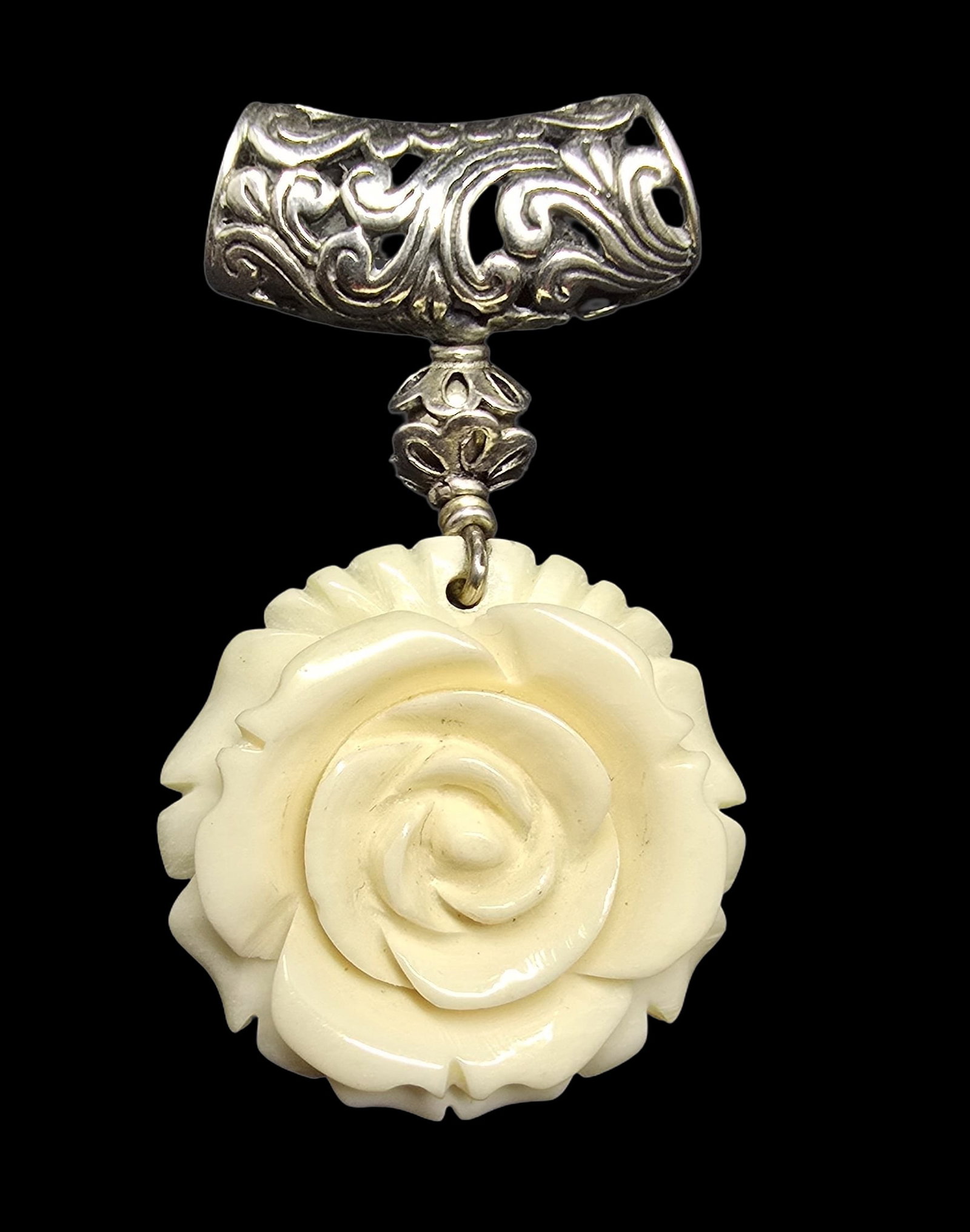 Beautiful Ornate Vintage Sterling Silver & Carved Bone Flower Pendant Charm: Very good vintage condition with minor patina according to age. Measures approx. 2 " long x 1" wide and weighs ca. 11.5 grams. Marked for Sterling Silver.