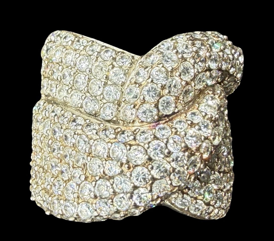 Beautiful Vintage Sterling Silver & Clear Rhinestone Cluster Cocktail Ring: Very good vintage condition with minor patina according to age. Measures approx. 3/4" long and 1" wide and weighs ca. 10.5 grams. The ring is a size 7 3/4". Marked for Sterling Silver.