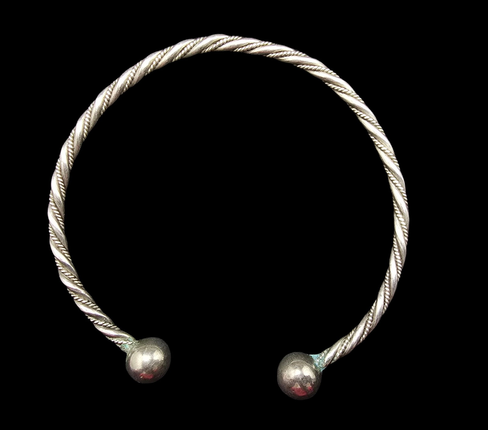 Stylish Vintage Sterling Silver Twisted Cable Cuff Bracelet: Very good vintage condition with minor patina according to age. Measures approx. 2 1/2" wide (inside diameter) and weighs ca. 11.5 grams. Tested for Sterling Silver.