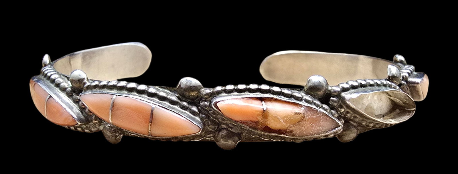 Rare Vintage Native American Zuni LOWSAYATEE Sterling Silver & Pink Conch Shell Cuff Bracelet: Good vintage condition with minor patina according to age; some damage. Measures approx. 2" wide (inside diameter) and weighs ca. 11 grams. Signed.