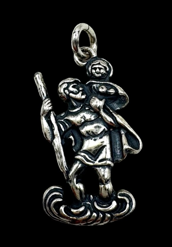Vintage Sterling Silver Saint Christopher Pendant Charm: Very good vintage condition with minor patina according to age. Measures approx. 1" long x 1/2" wide and weighs ca. 3.7 grams. Marked for Sterling Silver.and carrying an unidentified designer mark.