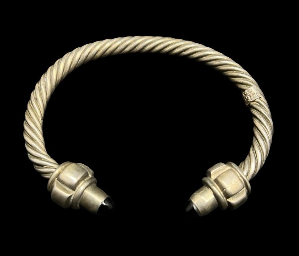 Stylish Vintage Sterling Silver & Black Onyx Twisted Cable Bracelet: Very good vintage condition with minor patina according to age. Measures approx. 7" long and 1 1/4" wide and weighs ca. 53.8 grams. Marked for Sterling Silver.