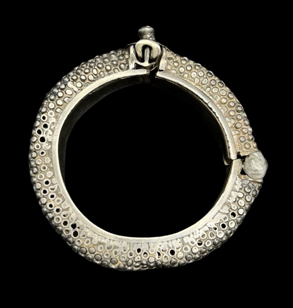 Unusual Ornate Vintage Sterling Silver Bangle Bracelet: Very good vintage condition with minor patina according to age. Measures approx. 7 3/4" long and 5/8" wide and weighs ca. 41.5 grams. Marked for Sterling Silver.