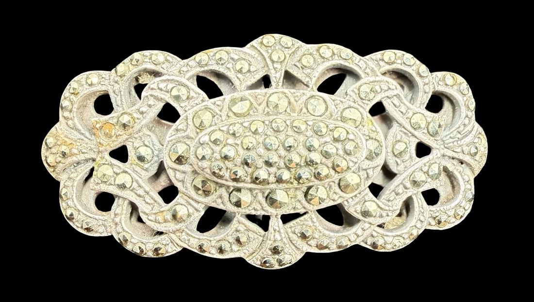 Large & Ornate Vintage Sterling Silver & Marcasite Cocktail Ring: Very good vintage condition with minor patina according to age. Measures approx. 1 1/2" long and 3/4" wide and weighs ca. 13.2 grams. The ring is a size 6 1/4". Marked for Sterling Silver.
