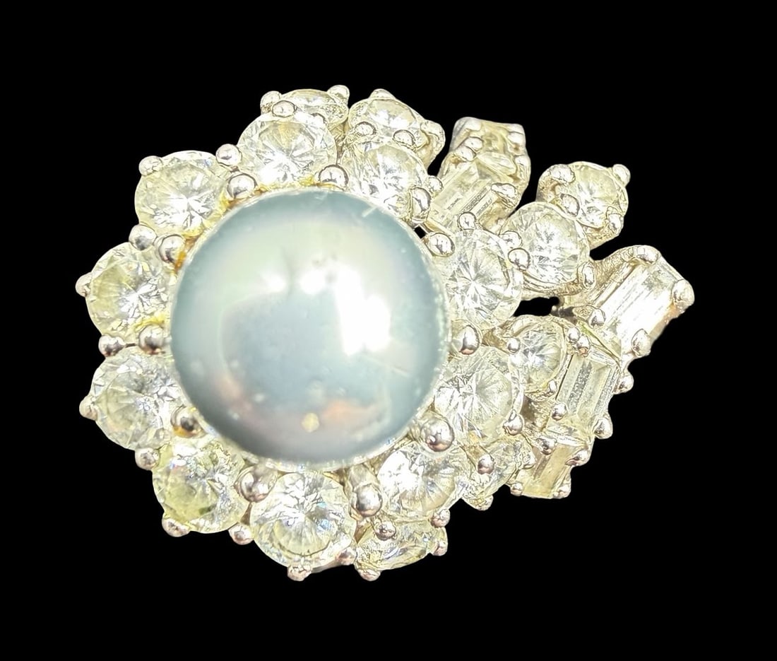 Gorgeous & Unusual Vintage Sterling Silver, Clear Rhinestone & Pearl Ring: Very good vintage condition with minor patina according to age. Measures approx. 1" long and 3/4" wide and weighs ca. 10.1 grams. The ring is a size 6 1/4". Marked for Sterling Silver.