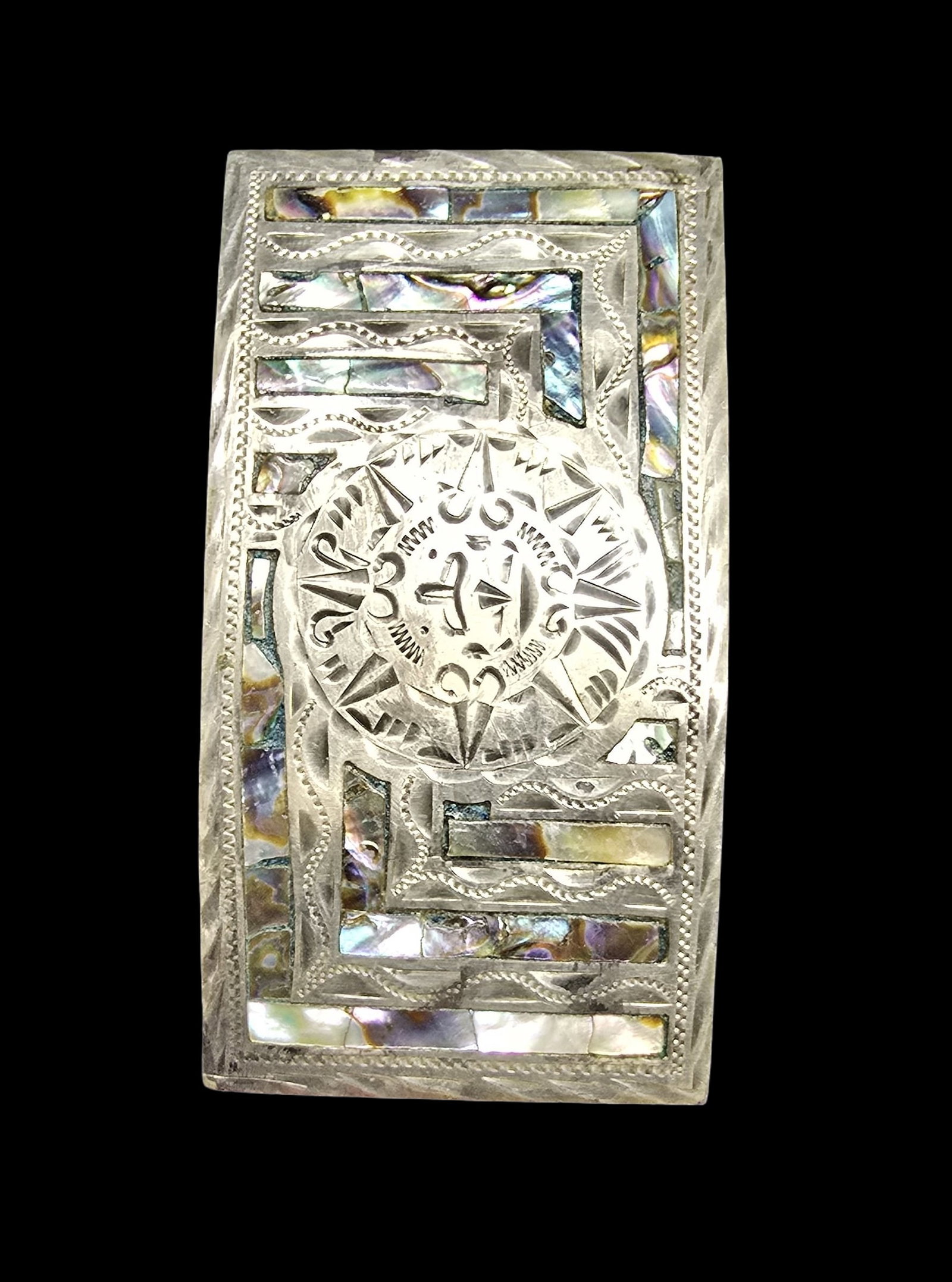 Gorgeous Ornate Vintage Sterling Silver & Mother of Pearl Belt Buckle: Very good vintage condition with minor patina according to age. Measures approx. 3 " long x 1 1/2" wide. Marked for Sterling Silver.