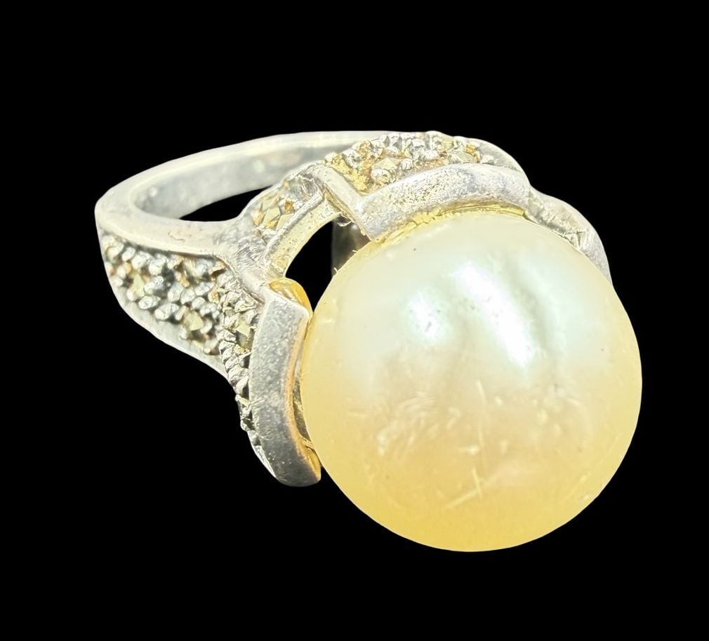 Gorgeous Vintage Sterling Silver, Marcasite & Large Pearl Ring: Very good vintage condition with minor patina according to age. Measures approx. 1/2" long and 1/2" wide and weighs ca. 8.9 grams. The ring is a size 4 1/2". Marked for Sterling Silver.