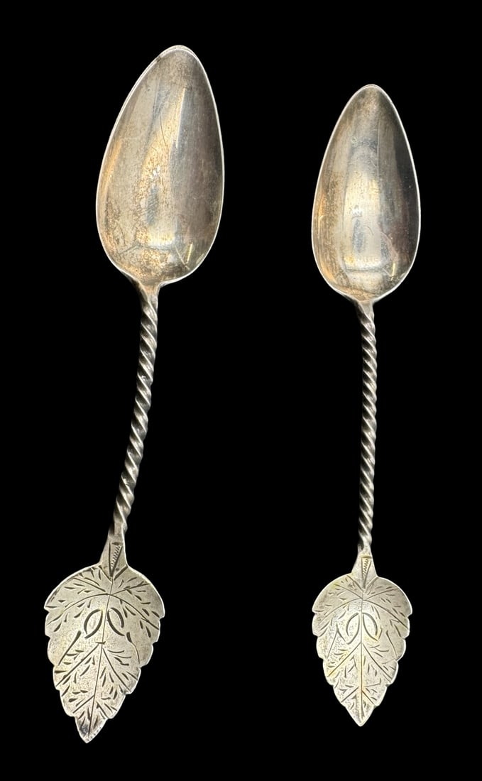 Pair of Ornate Antique Dutch 800 Silver Spoons /w Twisted Stems: Very good vintage condition with minor patina according to age. Each measures approx. 4 1/8" long and 3/4"wide & they jointly weigh ca. 13.3 grams. Marked for 800 Silver.