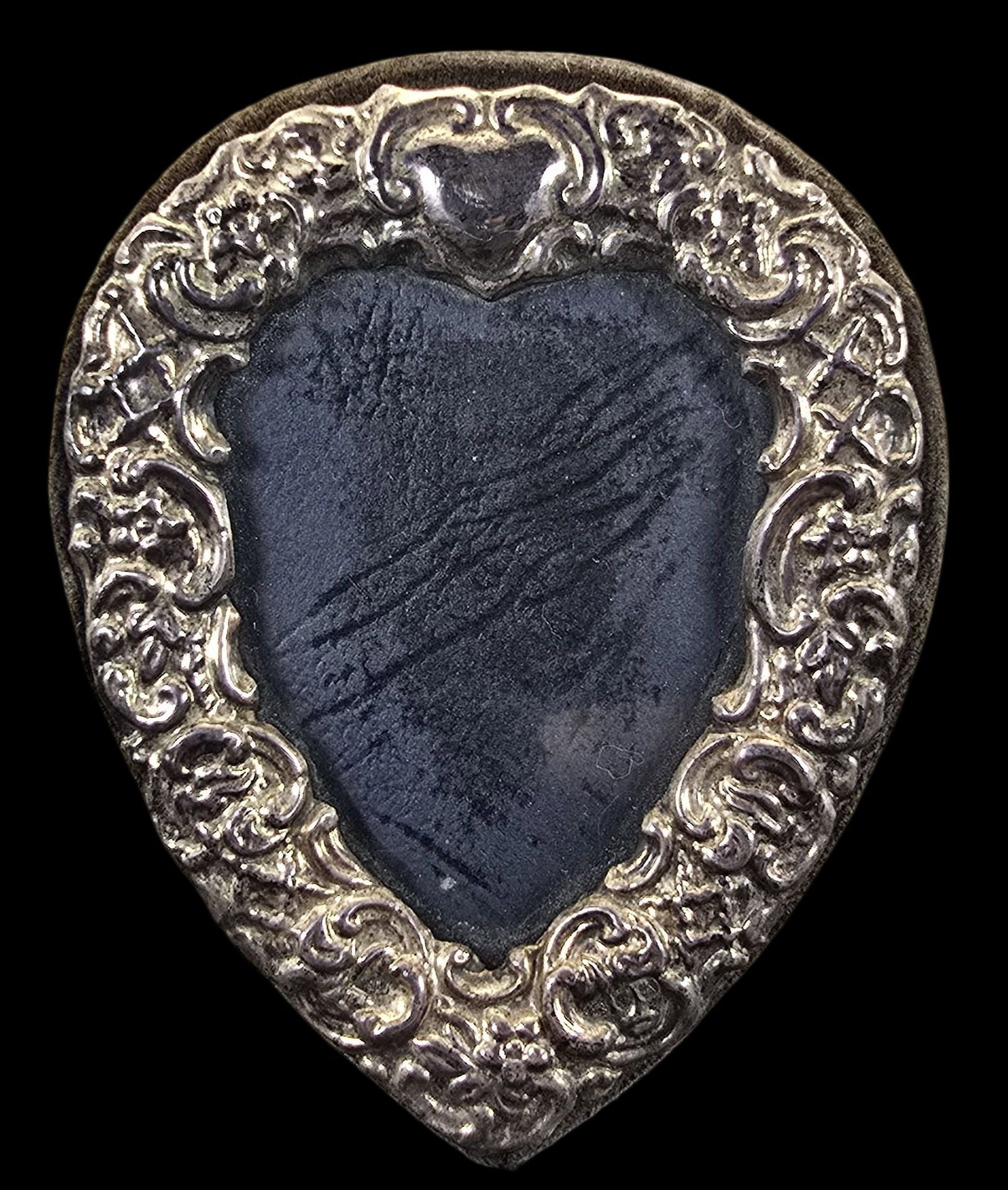 Vintage Sterling Silver & Suede Picture Frame: Very good vintage condition with minor patina according to age. Measures approx. 3 1/2" high and 2 1/2" wide and weighs ca. 37 grams.