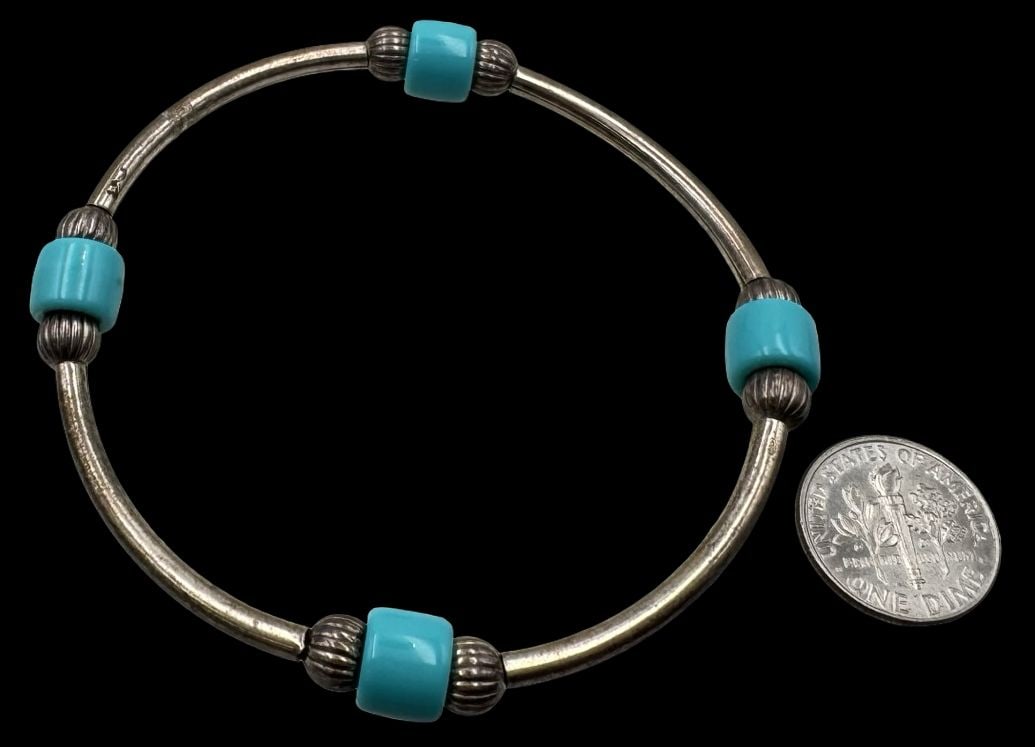 Stylish Vintage Sterling Silver & Turquoise Bead Bracelet: Very good vintage condition with minor patina according to age. Weighs 9.4 grams. Inside circumference is approx. 7". Marked for Sterling Silver.