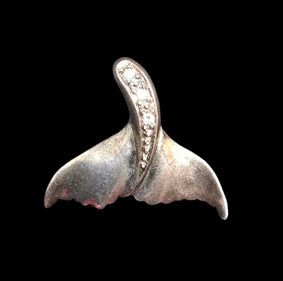 Vintage 925 Sterling Silver & Clear Gemstone Humpback Whale Tail Pendant Charm: Very good vintage condition with minor patina according to age. Measures approx. 1" long x 1" wide and weighs ca. 2 grams. Marked for 925 Sterling Silver.