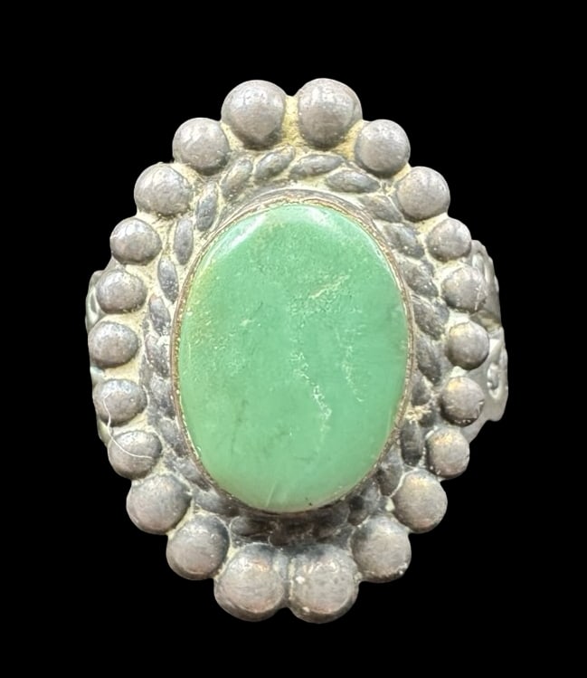 Ornate Vintage Native American Sterling Silver & Green Gemstone Ring: Very good vintage condition with minor patina according to age. Measures approx. 3/4" long and 1/2" wide & weighs ca. 4.3 grams. The ring is a size 5 3/4. Marked for Sterling Silver.