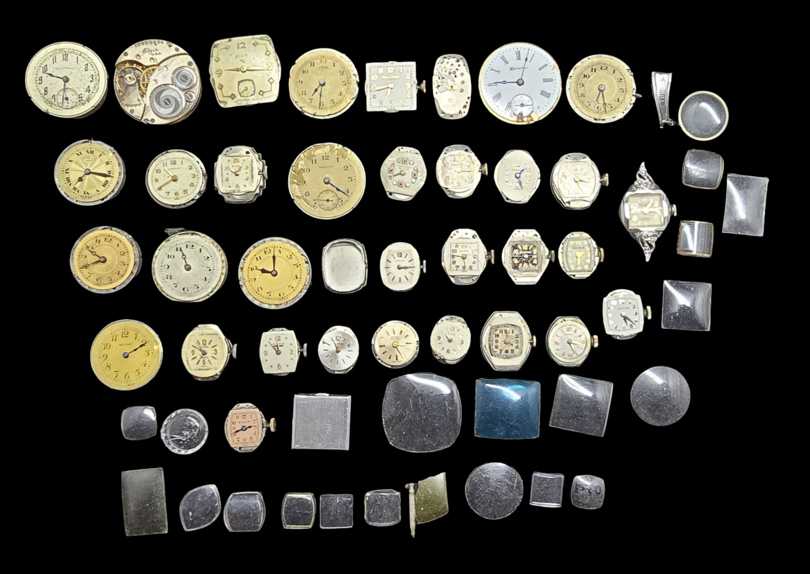 Large Lot of Watch Movements & Watch Parts: Very good vintage condition with minor patina according to age. The largest piece measures approx. 1" high and 1" wide and the entire lot weighs ca. 230 grams.