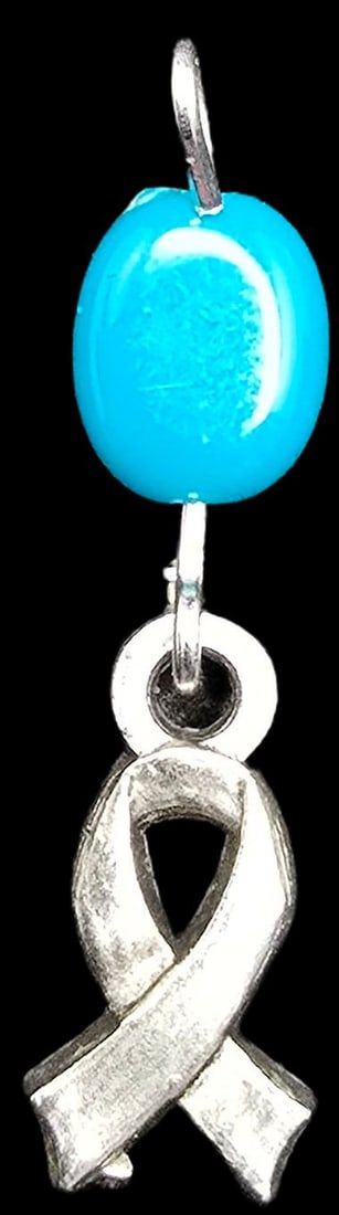 Beautiful Vintage Silver-Tone Metal & Blue Gemstone Cancer Awarness Costume Jewelry Pendant: Very good vintage condition with minor patina according to age. Measures approx. 1" long and weighs ca. 0.5 grams.