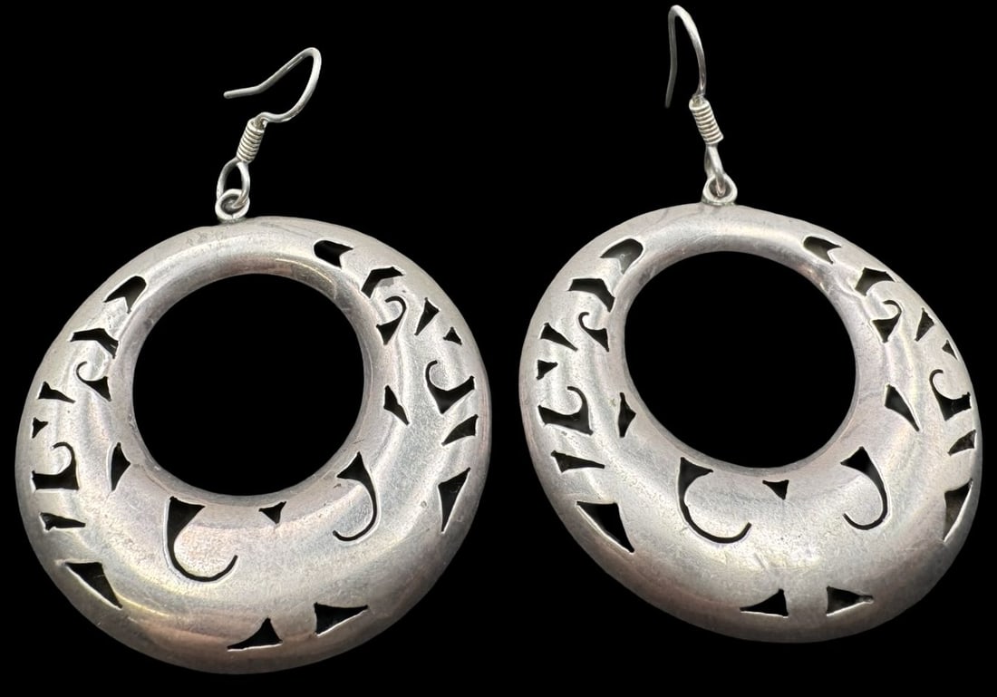 Vintage Mid-Century Modern TAXCO Mexico 925 Sterling Silver Hoop Earrings: Very good vintage condition with minor patina according to age. Each measures approx. 1 1/2" in diameter and they jointly weigh ca. 8.6 grams. Marked for 925 Sterling Silver.