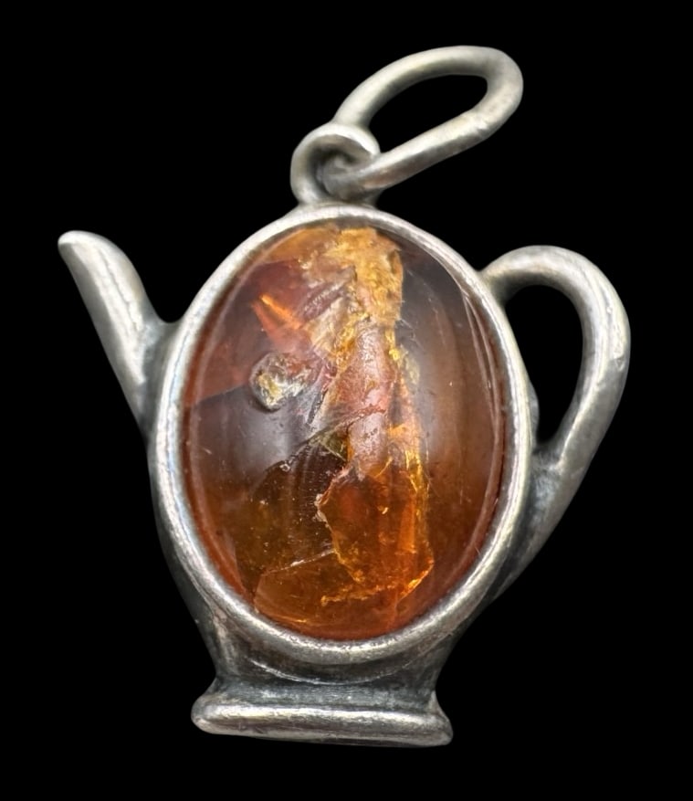 Charming Sterling Silver & Amber Teapot Pendant Charm: Very good vintage condition with minor patina according to age; some wear to surface. Measures approx. 7/8" long x 5/8" wide and weighs ca. 1.9 grams. Marked for Sterling Silver.