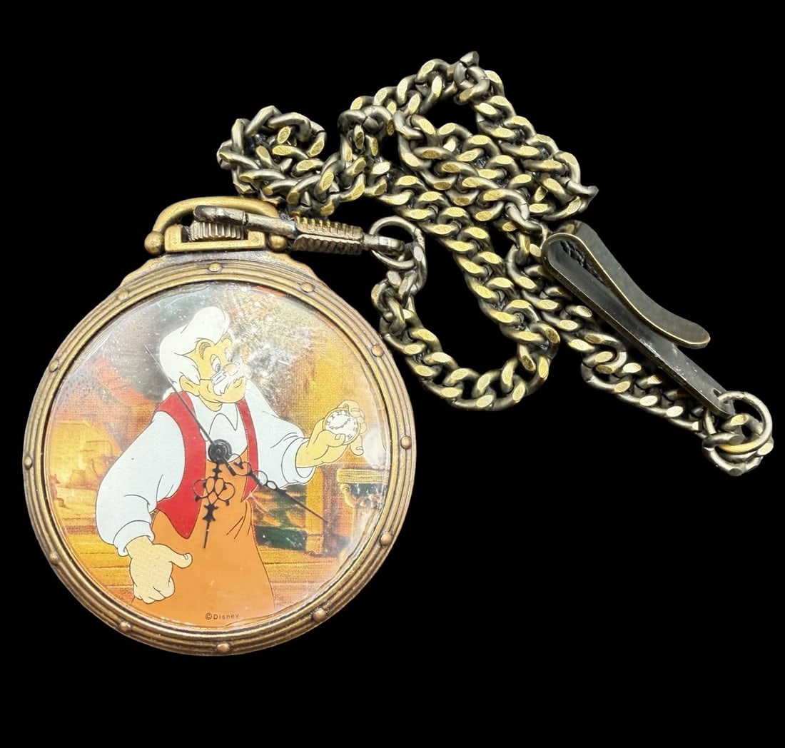 Beautiful Ornate Vintage DISNEY Pinocchio by FOSSIL Limited Edition Stainless Steel Pocket Watch /w: Very good vintage condition with minor patina according to age. Dial measures approx. 1 1/2" long and 1 1/2" wide and weighs ca. 62.5 grams. Marked for DISNEY Pinocchio & Limited Edition 0038/7500 . T