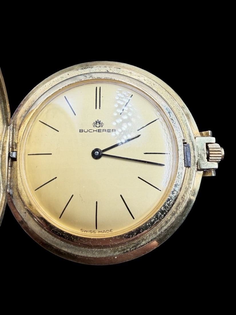 Gorgeous Vintage Swiss BUCHERER Gold Filled Pocket Watch: Very good vintage condition with minor patina according to age. Dial measures approx. 1 1/4" long and 1 1/4" wide and weighs ca. 39.6 grams. Marked for BUCHERER. The timepiece is functional.