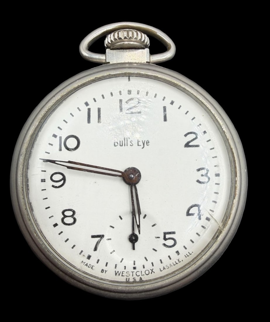 Gorgeous Vintage BULLS EYE Silver-Tone Metal & White Dial Pocket Watch: Very good vintage condition with minor patina according to age. Dial measures approx. 1 1/2" long and 1 1/2" wide and weighs ca. 49 grams. Marked for BULLS EYE. The timepiece is functional.