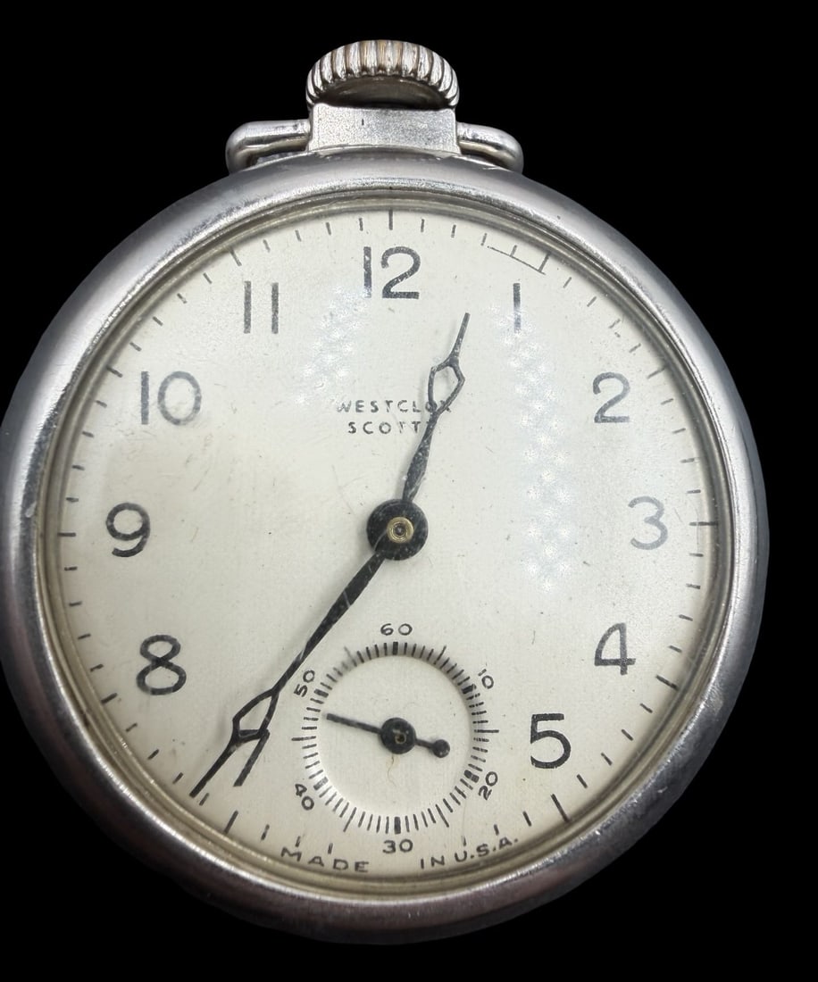 Beautiful Vintage WESTCLOX Silver-Tone Metal & White Dial Pocket Watch: Very good vintage condition with minor patina according to age. Dial measures approx. 1 1/2" long and 1 1/2" wide and weighs ca. 59.5 grams. Marked for WESTCLOX. The timepiece is functional.