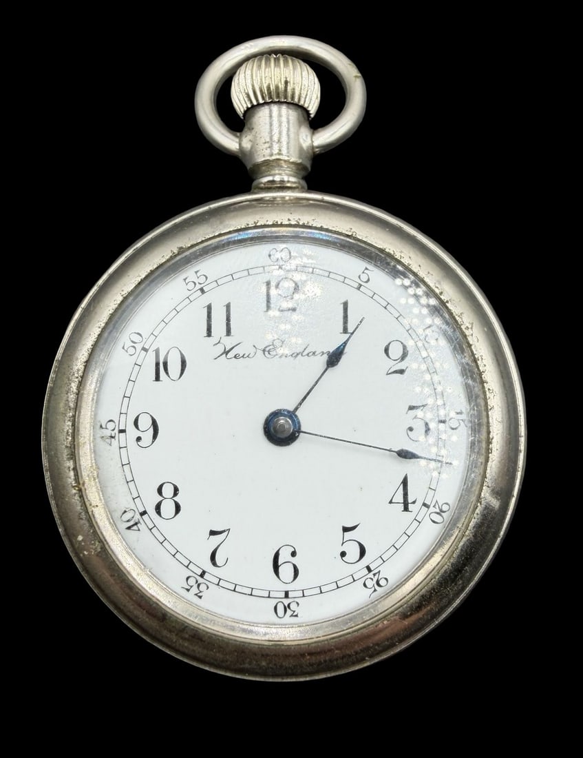 Gorgeous Ornate Vintage NEW ENGLAND Silver-Tone Metal & White Dial Pocket Watch: Very good vintage condition with minor patina according to age. Dial measures approx. 1" long and 1" wide and weighs ca. 55.1 grams. Marked for NEW ENGLAND. The timepiece is functional.