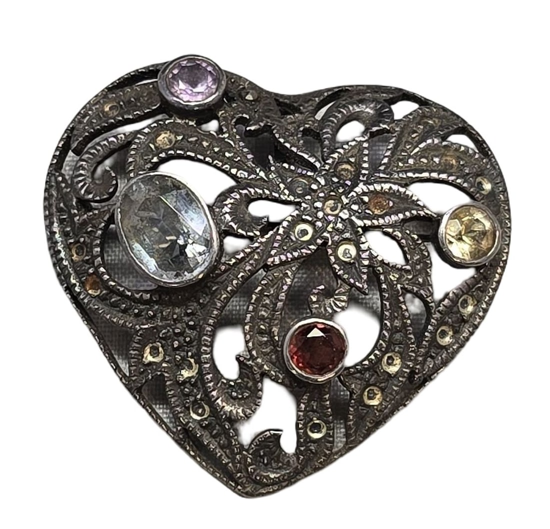 Beautiful Sterling Silver & Multi Stone Heart Shaped Brooch Pin: Very good vintage condition with minor patina and wear according to age. Measures approx. 1 1/2" high x 1" wide and weighs ca. 7.5 grams.