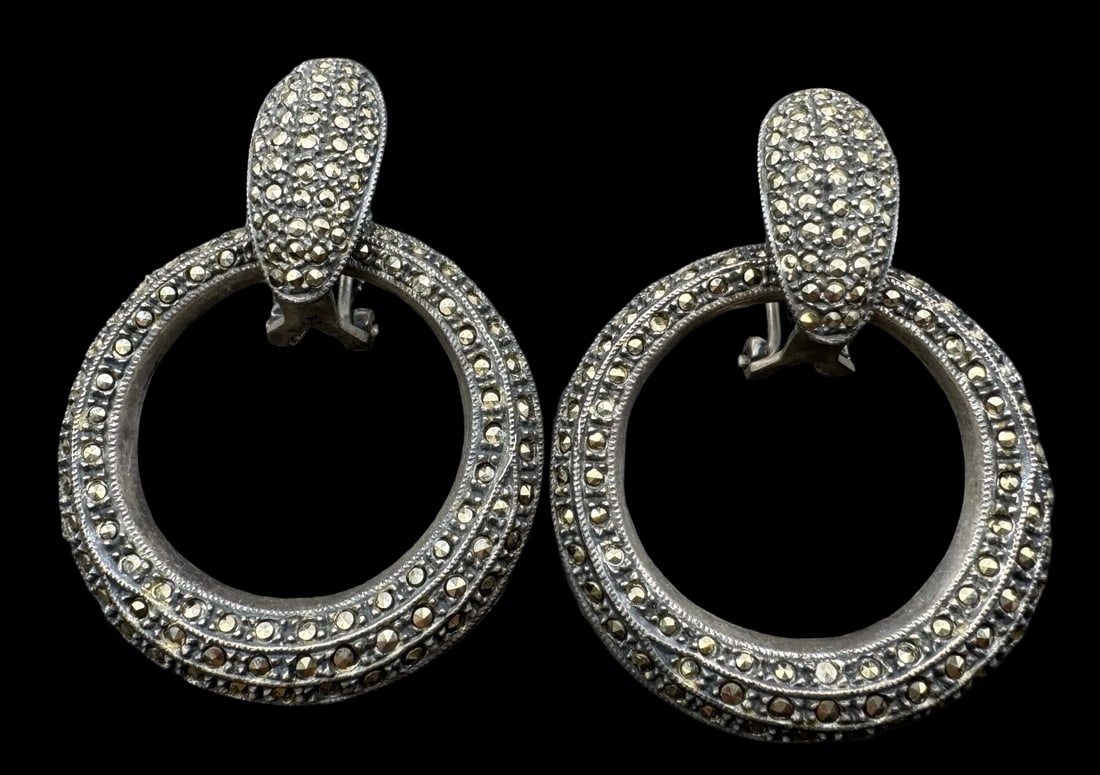 Beautiful Large Vintage Sterling Silver & Marcasite Earrings: Very good vintage condition with minor patina according to age. Each measures approx. 2 1/8" long from top to bottom and the circle measures approx. 1 5/8" in diameter. Total weight is ca. 31.6 grams.