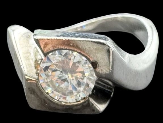 Vintage Sterling Silver & Clear Rhinestone Ring: Very good vintage condition with minor patina according to age. Measures approx. 3/8" long and 3/8" wide and weighs ca. 4.3 grams. The ring is a size 6 3/4. Marked for Sterling Silver.