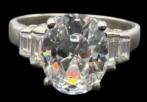 Vintage Sterling Silver & Clear Rhinestone Ring: Very good vintage condition with minor patina according to age. Measures approx. 3/8" long and 1/4" wide and weighs ca. 4.1 grams. The ring is a size 6 3/4. Marked for Sterling Silver