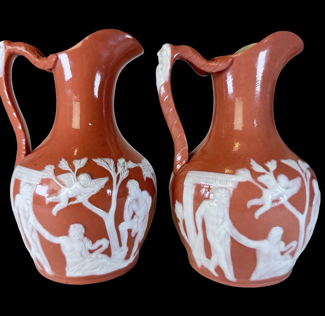 Pair of Antique 19th Century SAMUEL ALCOCK & CO. P?te-sur-P?te Porcelain Pitchers: Very good vintage condition with minor patina according to age; wear and patina according to age; no chips, cracks, or repairs. Each measures approx. 8" high and 5" wide.