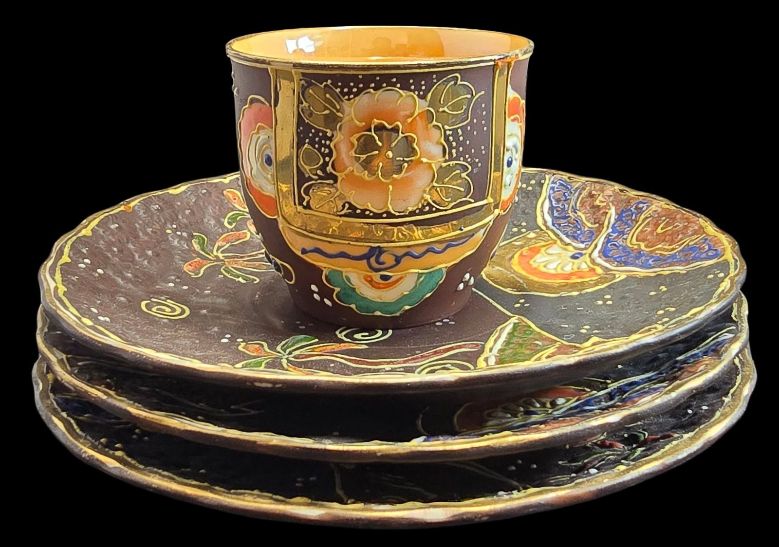 Beautiful Vintage Handpainted Japanese Satsuma Ceramic Cup and Saucers: Very good antique condition with minor wear according to age; no chips, cracks, or repairs. Cup measures approx. 2" high x 2 1/2" in diameter and the saucer measures approx. 5 1/2" in diameter.