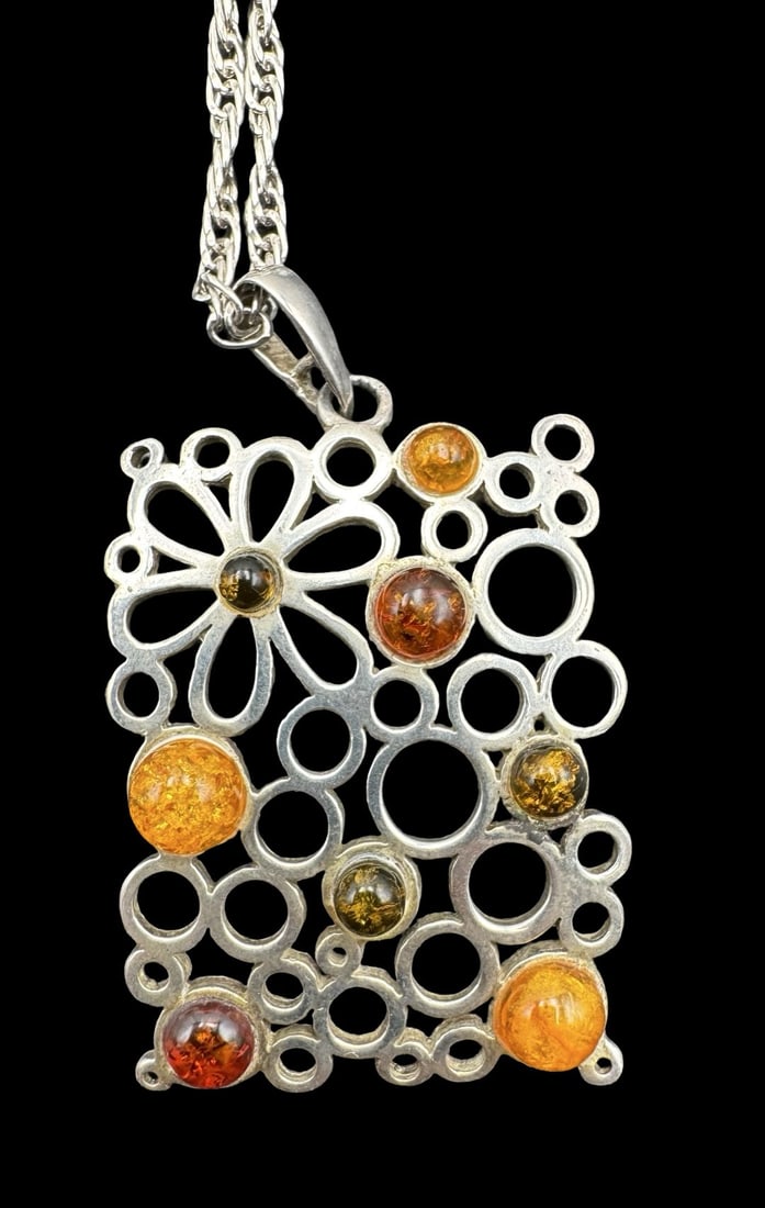 Gorgeous Vintage Mid-Century Modern Sterling Silver & Amber Pendant Necklace: Very good vintage condition. Measures approx. 17.5" long. Pendant measures approx. 1.5" long, 1" wide. Weighs approx. 17.18 grams. Marked for Sterling Silver.