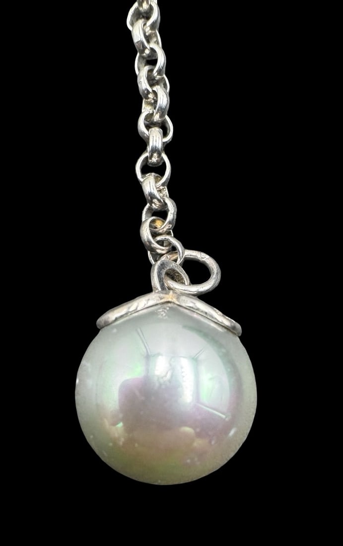 Stylish Vintage Sterling Silver & Pearl Pendant Charm: Very good vintage condition. Measures approx. 2.5" long, 1/2" wide. Pearl measures approx. 1/2" long, 1/2" wide. Weighs approx. 6.43 grams. Marked for Sterling Silver.
