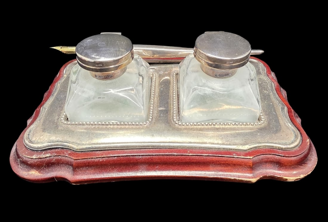 Beautiful Antique British Sterling Silver & Wood Desk Set: Very good antique condition with wear and patina according to age. The base measures approx. 6 3/4" long x 4 1/4" wide; the inkwells approx. 1 3/4" high x 1 3/4" long x 1 3/4" wide; the pen approx. 6"