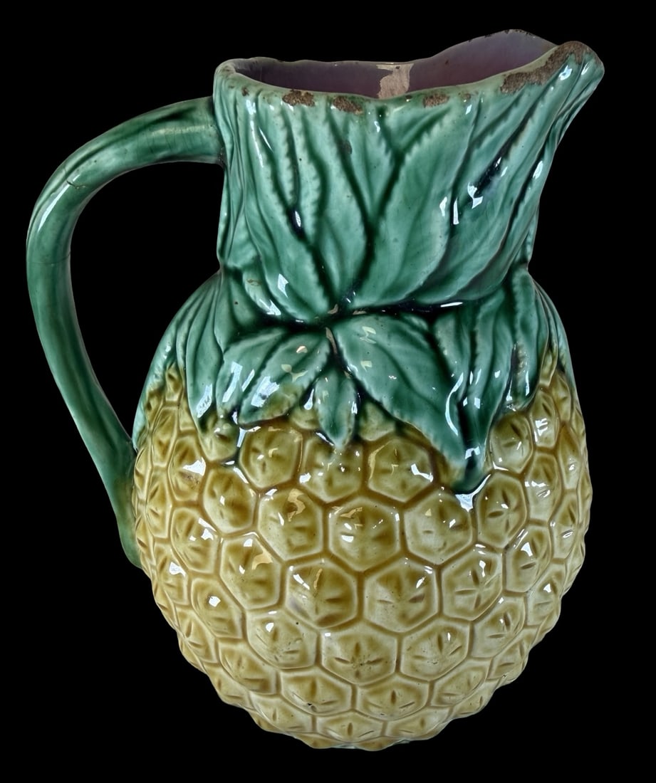 Antique 19th Century European Majolica Glazed Ceramic Pineapple Pitcher: Very good antique condition with wear and patina according to age; no cracks or repairs; very minor chipping. Measures approx. 5" long x 6" wide x 6" high. Marked