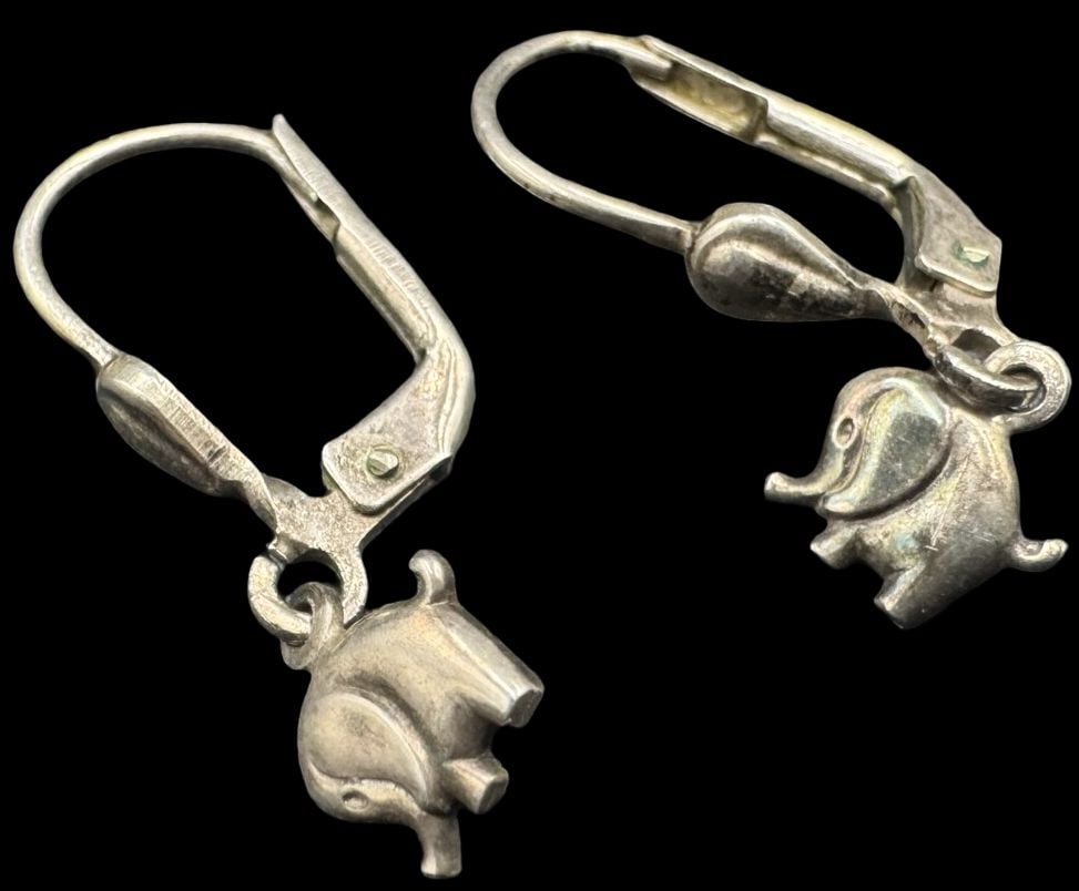 Beautiful Vintage Sterling Silver Elephant Designer Earrings: Very good vintage condition with minor patina according to age. Each measures approx. 1" long x 1/4" wide and they jointly weigh ca. 1.2 grams. Marked for Sterling Silver and signed.