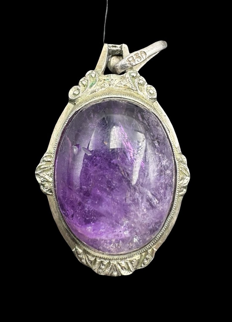 Stylish Vintage Scandinavian 830 Silver & Amethyst Pendant: Very good vintage condition with minor damage to the gemstone. Measures approx. 1.25" long, 1/2" wide. Weighs approx. 1.93 grams. Crafted from 830 Sterling Silver.