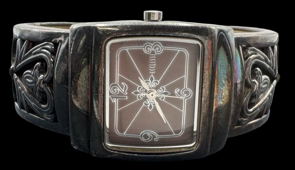 Stylish Vintage ECCLISSI Sterling Silver Cuff Bracelet Watch: Very good vintage condition with minor patina according to age. Measures approx. 1" wide & weighs ca. 44 grams. Inner circumference is approx. 6 1/4". Marked for Sterling Silver & ECCLISSI.
