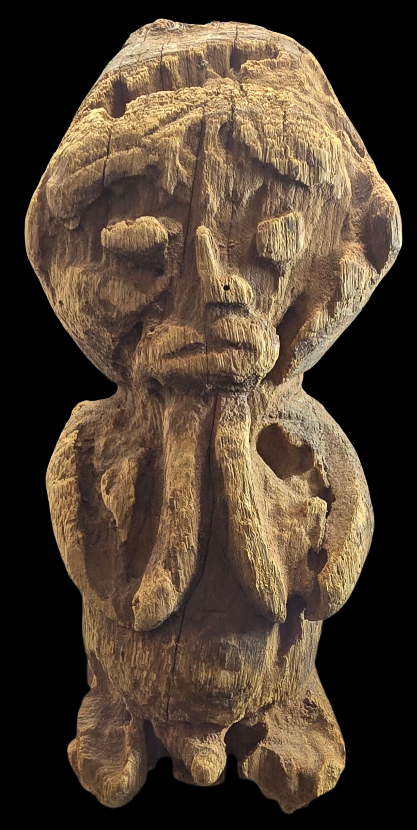 Ancient Hand Carved Wood Tribal Statue on Acrylic Base: Good antique condition with wear and patina according to age; see pictures. Measures approx. 11" high x 4 1/2" wide. Mounted on an acrylic base.