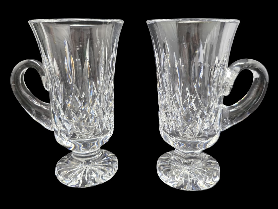 Rare Pair of Vintage 1960s WATERFORD Crystal Irish Coffee Mugs: Very good vintage condition; no chips, cracks, or repairs. Each measures approx. 5 1/2" high x 3 1/2" wide (with handle); 3" in top and 2 1/4" in base diameter. Etched with the Waterford mark.