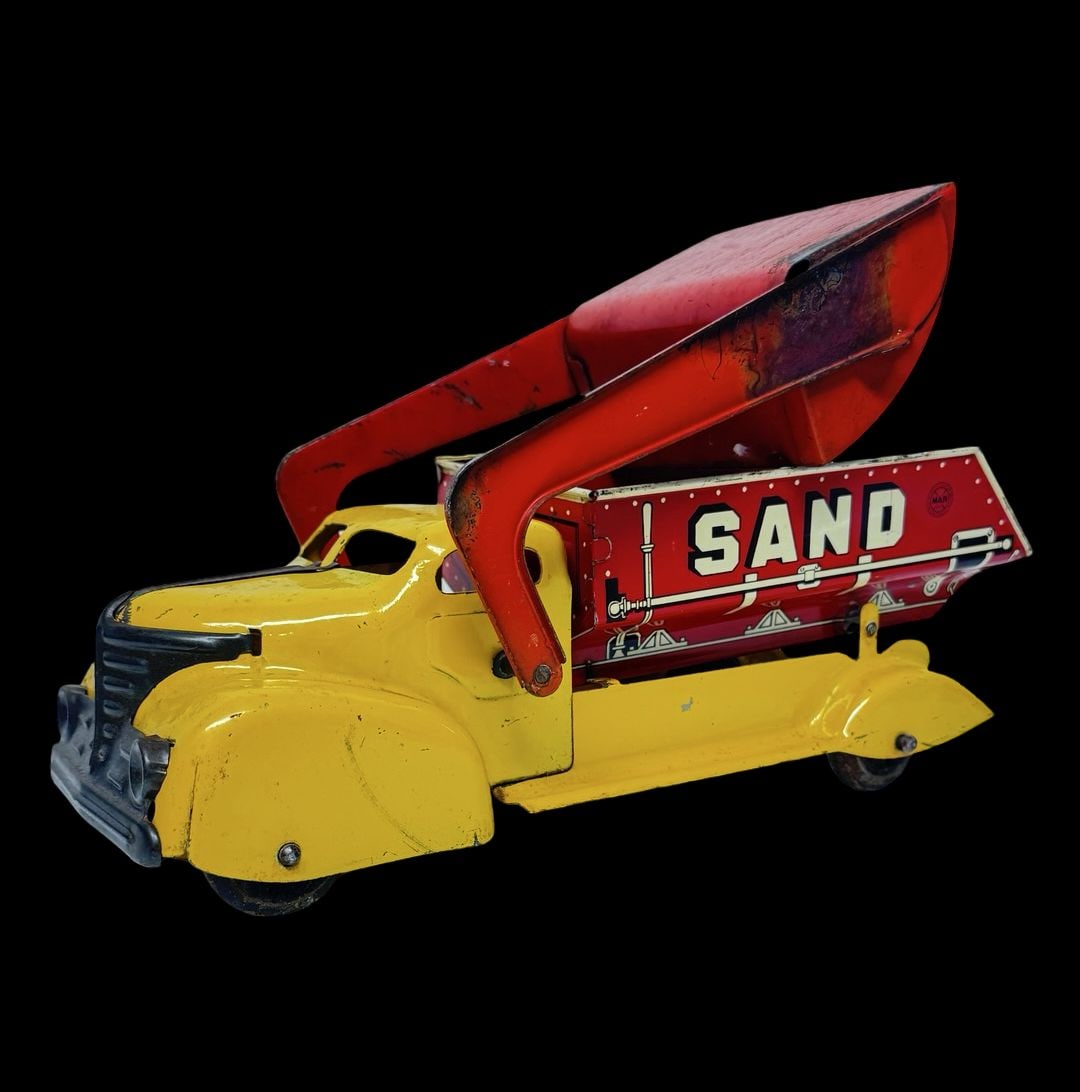 Vintage MARX TOYS Pressed Steel Sand / Gravel Dump Truck Toy: Good vintage condition with wear and patina according to use and age, please see pictures. Measures approx. 15" long and 5 1/2" wide and 4 1/2" high.
