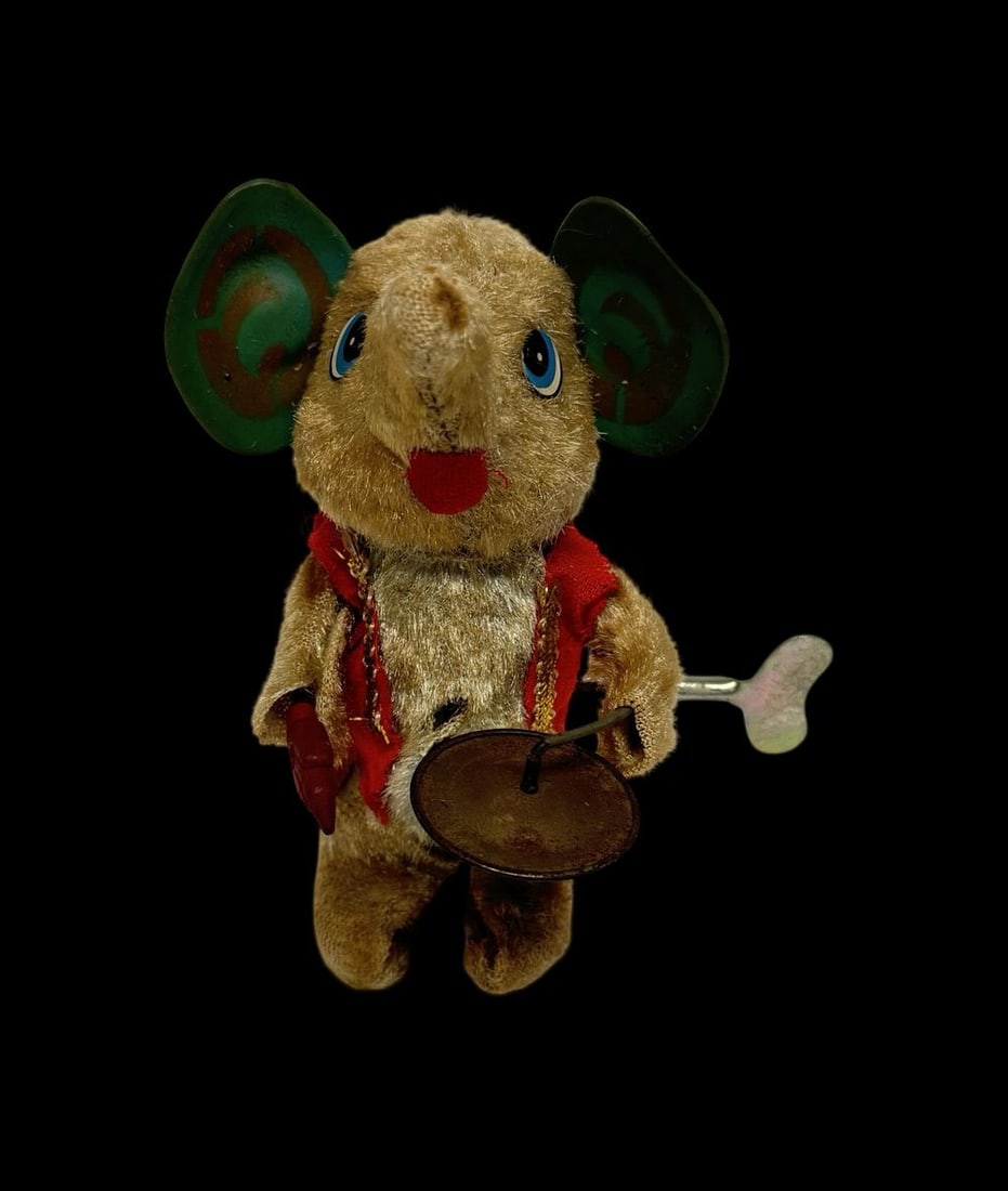 Vintage Ca.1970s Mambo the Drumming Elephant Mechanical Tin & Plush Wind-Up Toy: Good vintage condition with wear and patina according to use and age, please see pictures. Measures approx. 3" long and 2" wide and 6" high. Made in Japan.