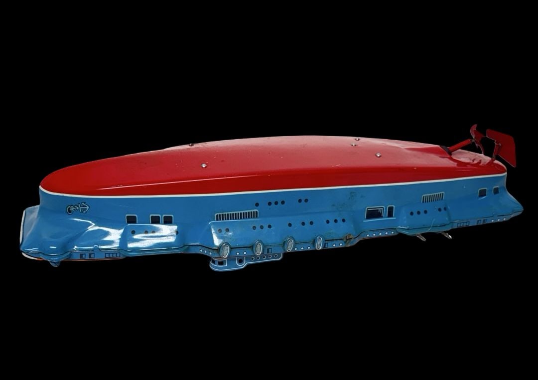 Vintage Ca. 1950 MARUSAN TOYS Japan Lithographed Tin Wind -Up Aircraft Carrier Toy: Good vintage condition with wear and patina according to use and age, please see pictures. Measures approx. 13" long and 5" wide and 3 1/2" high. Made in Japan.