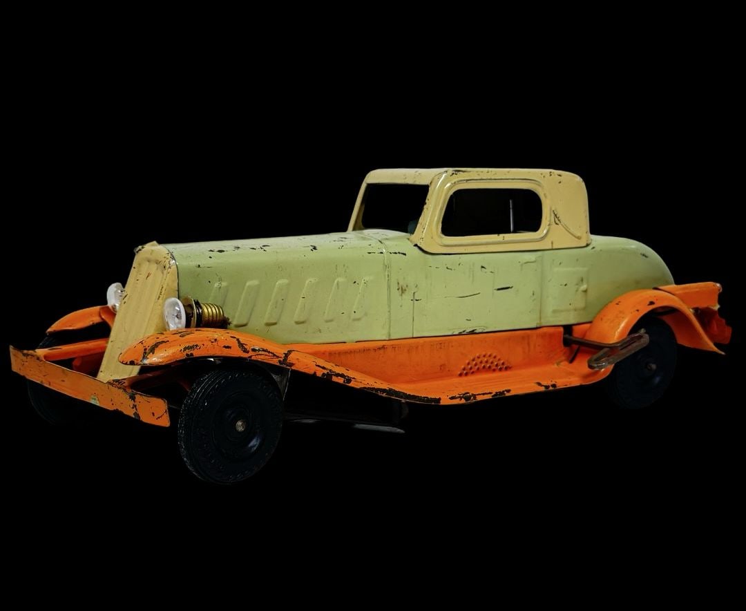 Antique Ca. 1930s GIRARD Pressed Steel Piece Arrow Deluxe Coupe Toy: Good antique condition with wear and patina according to use and age, please see pictures. Measures approx. 14" long and 5" wide and 4" high.