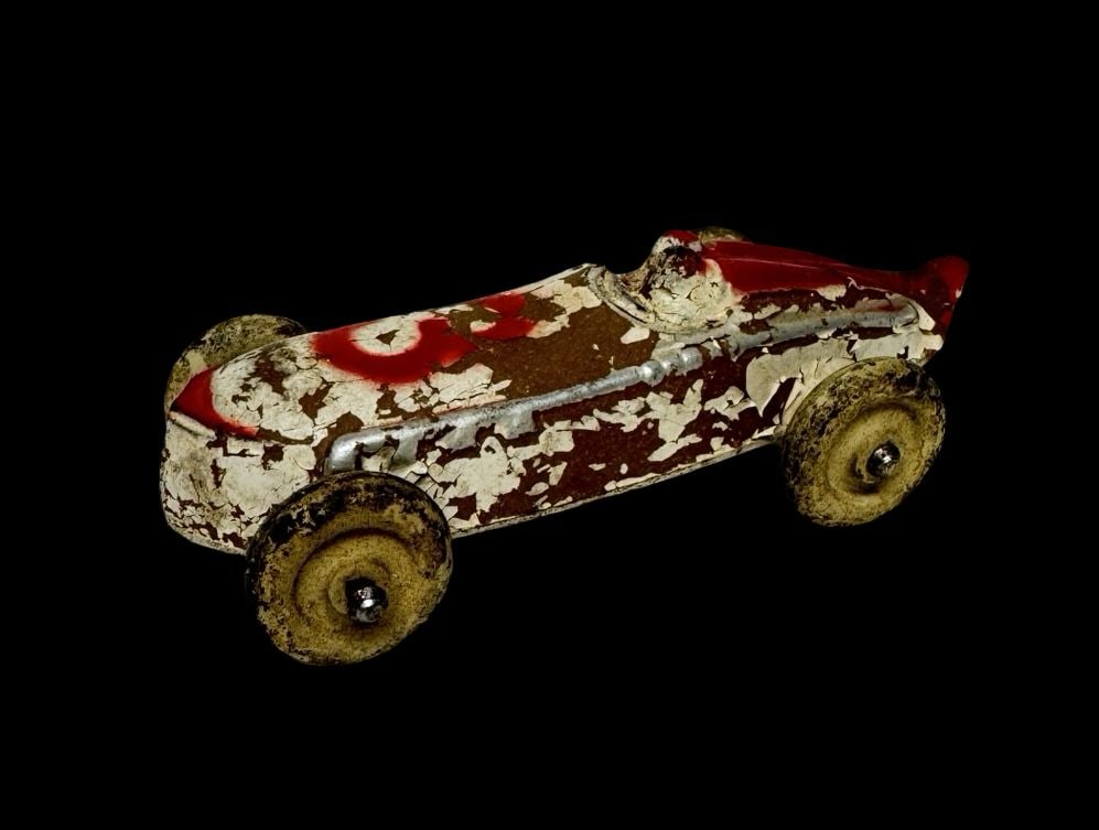 Antique Ca. 1930's Sun Rubber Co. U.S.A. Race Car Toy: Good vintage condition with wear and patina according to use and age, please see pictures. Measures approx. 4" long and 2" wide and 1/2" high.