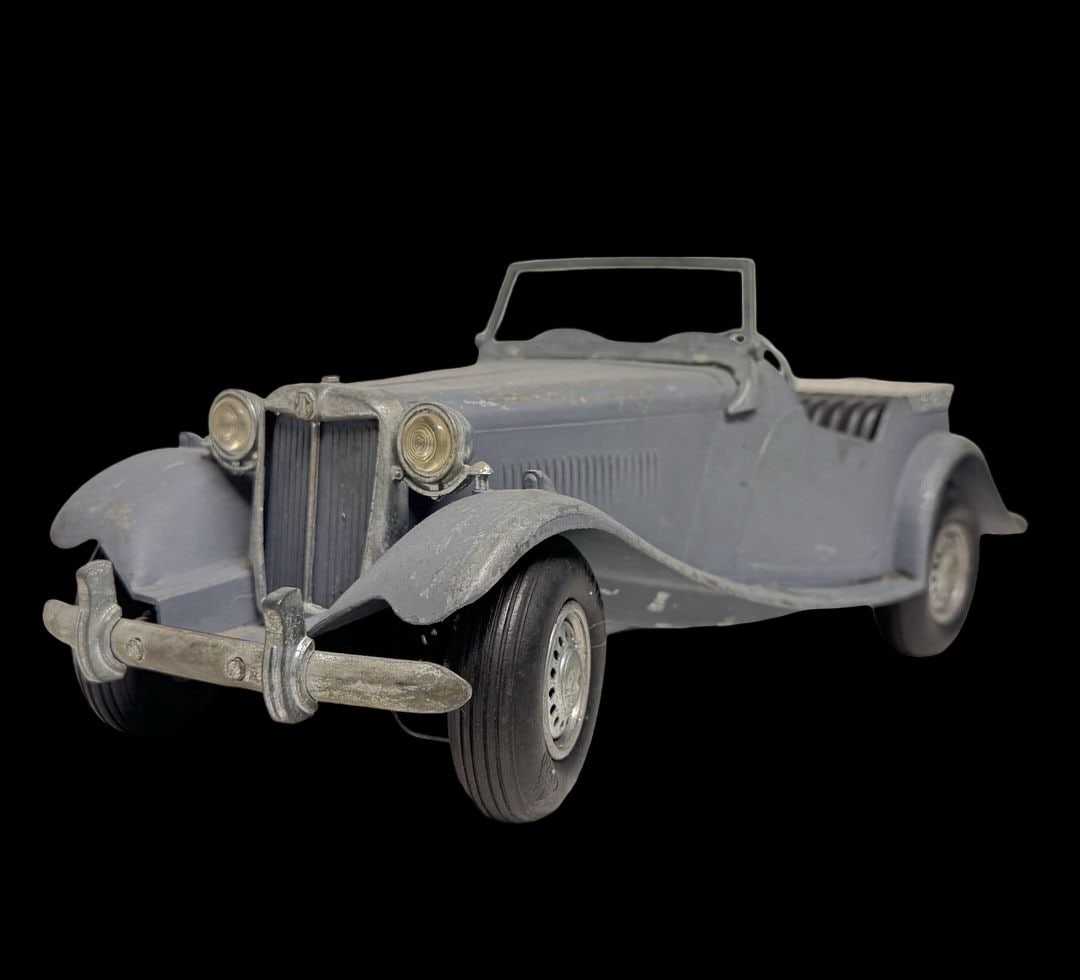 Vintage Ca. 1950s DOEPKE MODEL TOYS MG TD Die-Cast Metal Toy Car: Good vintage condition with wear and patina according to use and age, please see pictures. Measures approx. 15" long and 6" wide and 4" high.