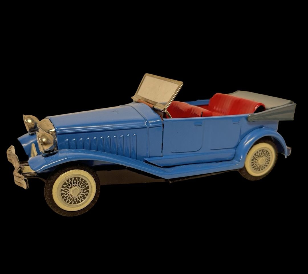 Vintage Ca. 1970s Japanese Blue 4-Door Sedan Touring Car Tin Friction Toy: Good vintage condition with wear and patina according to use and age, please see pictures. Measures approx. 8" long and 3" wide and 2.33" high. Made in Japan.