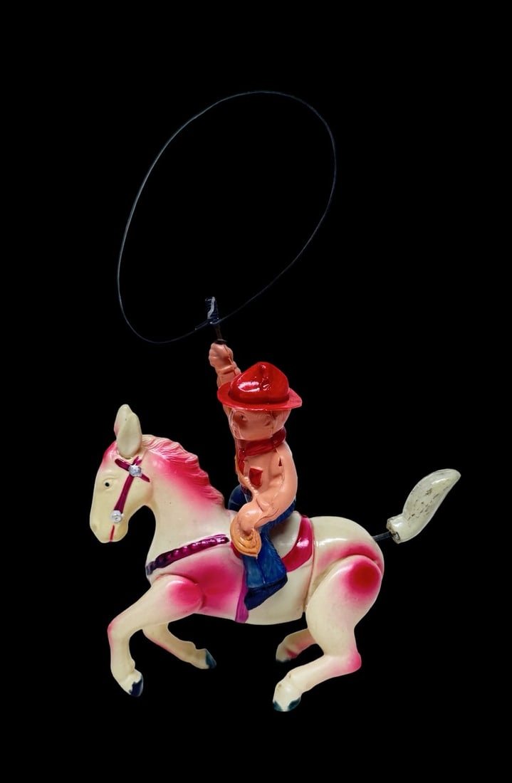 Vintage Celluloid Wind -Up Rancher w/ Horse Toy: Good vintage condition with wear and patina according to use and age, please see pictures. Measures approx. 6" long and 2" wide and 8" high. Untested.